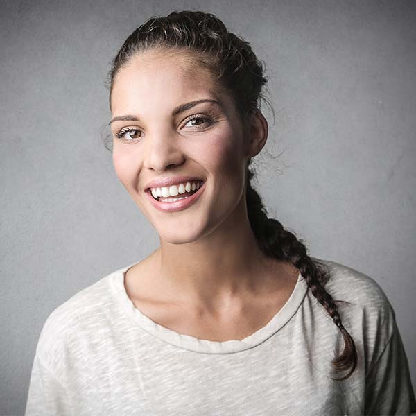 Dental Services - Young Woman with Beautiful Smile