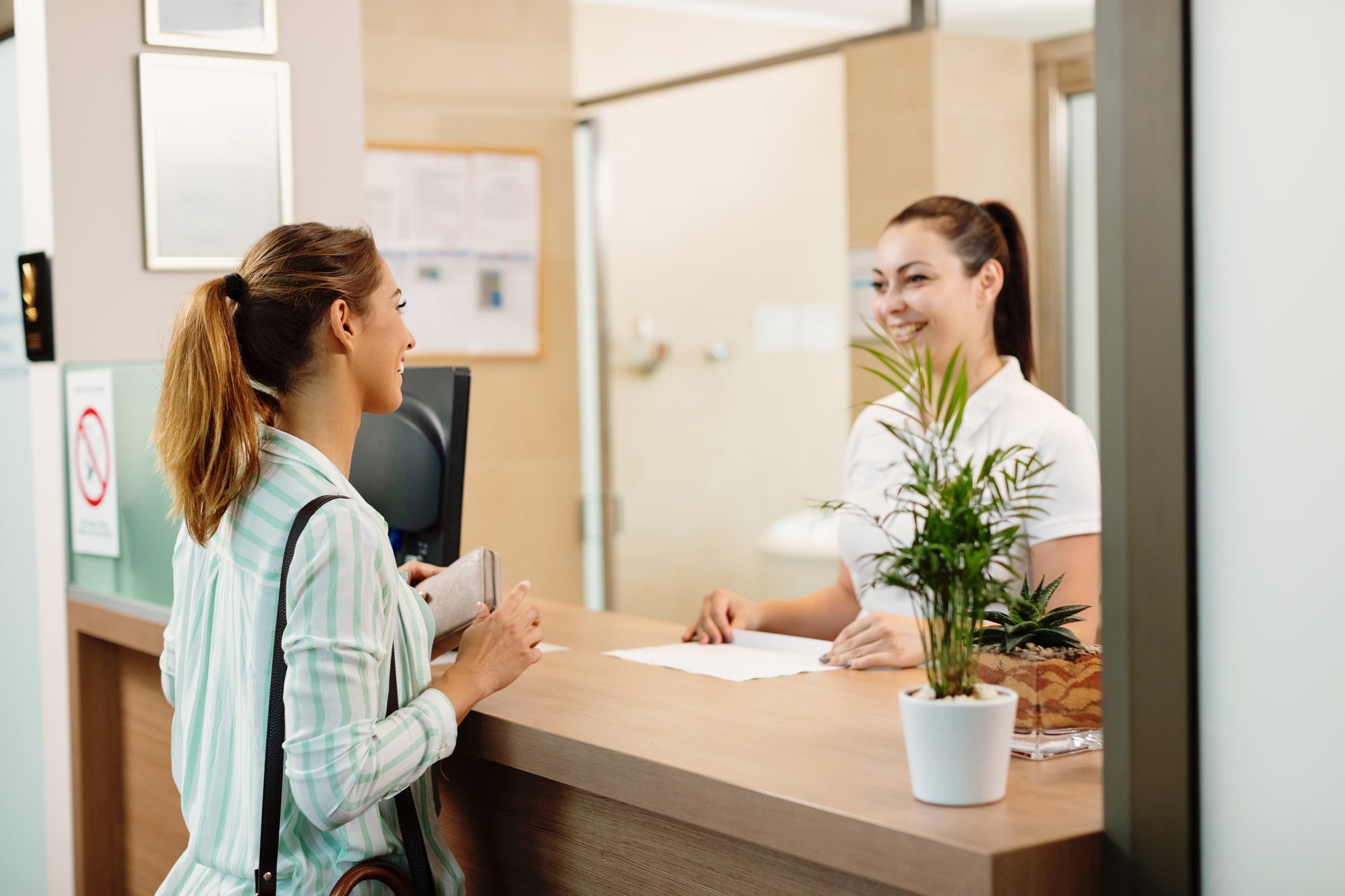 A smiling patient leaving a dental office after receiving same-day dentures, looking confident and relieved.