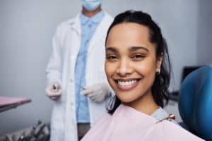 Patient smiling in the chair at Shelby Dental Center in Calera after getting a new crown.